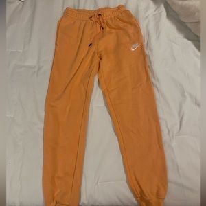 Coral, Orangish, NIKE SWEATPANTS. worn once, then too small.